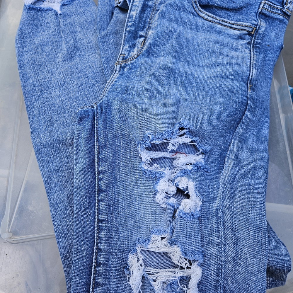Distressed Blue Jeans